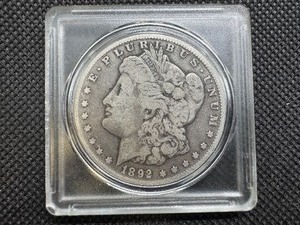 lot 19 image: 1892 O Morgan Silver Dollar