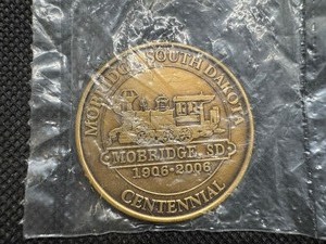 lot 60 image: Mobridge South Dakota Centennial Coin Medallion