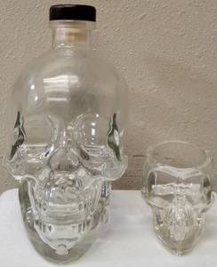 lot 83 image: (1) Crystal Head Vodka Bottle (Empty) In original box  (1) Skull Shot Glass