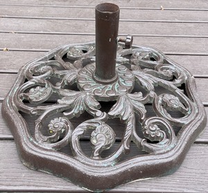 lot 80N image: Deck - Cast Iron Patio Umbrella Base with Ornate Detailing