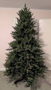 lot 99 image: ML - Frontgate 7.5 Foot Artificial Christmas Tree with Pine Cones and Light Strings