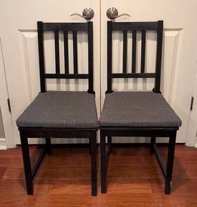 lot 140 image: SR - Pair of IKEA Black Wood Dining Chairs with Cushions