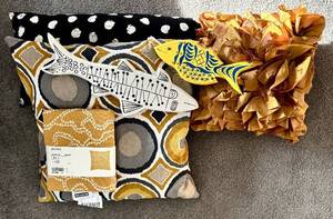 lot 235H image: LR - Decor Collection with Pillows, Wooden Painted Fish, and New Pillow Covers