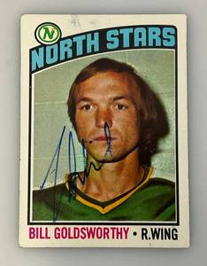 lot 103 image: 1976 Topps Autographed (Bill GOLDSWORTHY) NORTH STARS Trading Card (In Protective Sleeve)