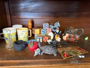 lot 19J image: Vintage Collectibles Lot with Care Bear Mug, Wooden Blocks, Pottery, Figurines, and Ephemera