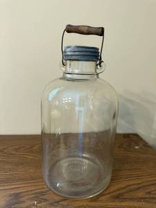 lot 35J image: Vintage 12-Inch Glass Jug with Metal Lid and Wooden Handle