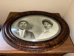 lot 38J image: Antique Oval Bubble Glass Portrait with Tiger Stripe Wood Frame, 23x17 Inches