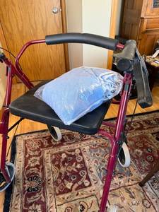 lot 56J image: Adult Mobility Walker with Seat and Bag of Blue Terry Cloth Adult Bibs