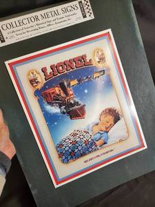 lot 36 image: Collector Metal Signs Lot - Lionel & American Flyer Train Signs