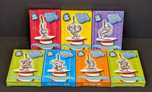 lot 40 image: Set of 7 Dr. Seuss Silver Plated Ornaments The Cat in the Hat Collection