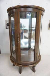 lot 152 image: Vintage (SMALL) 22.25x 12 Wood and Glass Display Cabinet Featuring a Curved Glass Door.