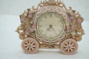 lot 257 image: Vintage Pink Fairytale Carriage Clock Figurine