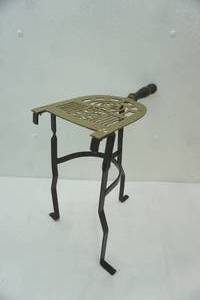 lot 279 image: Antique Iron Fireplace Trivet with a Wooden Handle