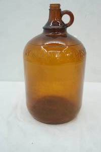 lot 280 image: Vintage Amber Brown Glass Jug. Roman Cleanser