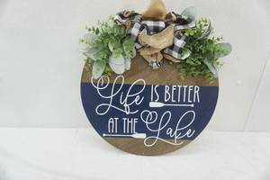 lot 303 image: Life is Better at the Lake. Wooden Wall Decor. 15 diameter