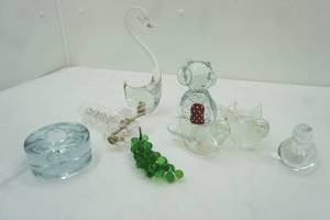 lot 389 image: Clear Lucite Grapes, Clear Glass Long Neck Swan, Clearred bubble glass owl figurine, glass iridescent seal, clear glass bird, puck candle holder