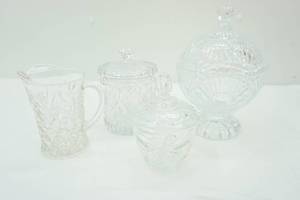 lot 472 image: Vintage Anchor Hocking Prescut Clear Creamer and Sugar, Biscuit BarrelCookie Jar, and Vintage Shannon Crystal Candy Dish in the Freedom pattern
