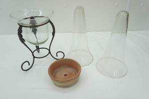 lot 476 image: Model T type flower vases, glass and metal vase, Mexico Terracotta Planter Base