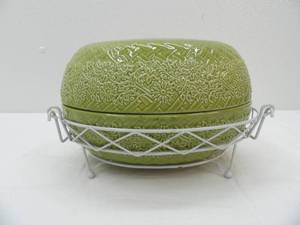 lot 566 image: Temp-tations Presentable Ovenware Oval Casserole Dish in Greenfloral and basket weave pattern. Comes with a matching metal stand