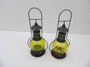 lot 590 image: Pair of Decorative Metal and Green Glass Lanterns. (battery operated fairy lights inside) 14 tall