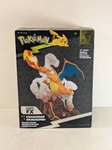 lot 180 image: NEW POKMON LIGHT FX CHARIZARD DELUXE FIGURE