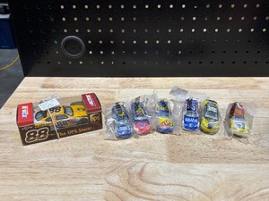 lot 7 image: 2003 Dale Jarrett #88 The UPS Store 143 Scale and 2006 Kellog Hot Wheel Set