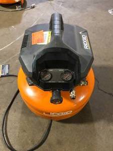 lot 9 image: RIDGID 6 Gal. 150 PSI Portable Electric Oil-Free Jobsite Pancake Air Compressor with Dual Pressure Gauges and 2-Quick Couplers For Parts Customer Returns See Pictures