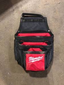 lot 17 image: Milwaukee 13 in. 3-Tier Material Pouch  Customer Returns See Pictures