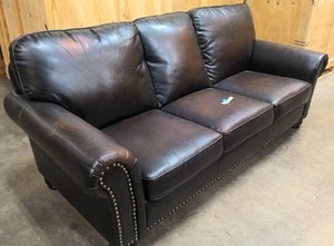 lot 12 image: Dark brown leather couch