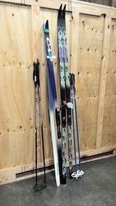 lot 28 image: Rossignol and Visu cross crounty skis with Rossignol poles and VM staven poles