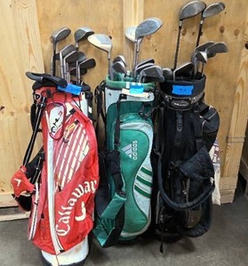 lot 73 image: three right handed sets of golf clubs and bags  R5 driver, and misc clubs