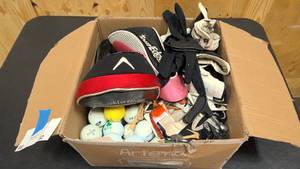 lot 82 image: Misc golf box  misc golf gloves, balls, tees, ball markers