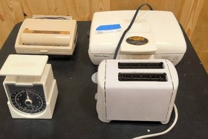 lot 131 image: Hamilton Beach Griddle, Oster Waffle maker, Scale, and toaster