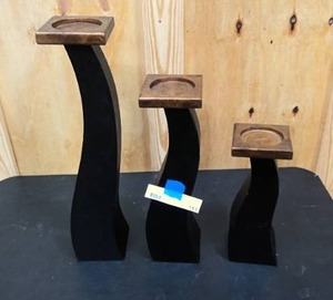 lot 165 image: Set of decorative wooden candle holders small, med, and large