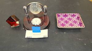lot 201 image: Living room dcor  Red cube, clock with globe, and decorative small dish