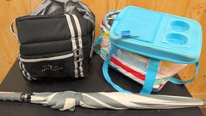 lot 205 image: Frauenchuh cooler, raindow cooler, and grey and white umbrella