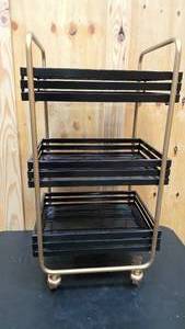 lot 206 image: Gold and black rolling metal tea cart 30 tall,  14 wide, and 16.5