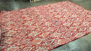 lot 213 image: Outdoor and Indoor large red patterned rug 86 by 126