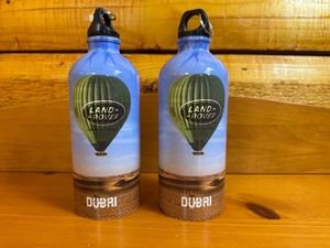 lot 44 image: Pair of Rare Land Rover Dubai Aluminum Bottles - Safari Balloon Platinum Heritage
