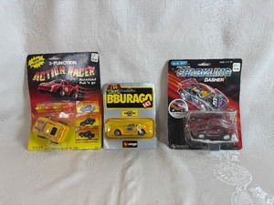 lot 128 image: Vintage Woolworth 3-Function Action Racer, Bbarago 143 Porsche 959 and Vintage Woolworth Blue Box Friction Sparkling Power Porsche