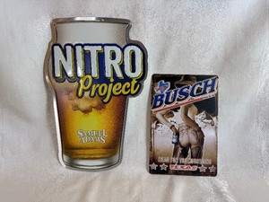 lot 138 image: Tin Beer Signs - Samuel Adams 12 x 17.5 and Busch Beer  8 x 11.75