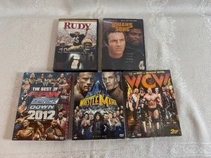 lot 221 image: Three Unopened Wrestling DVD 3 Disc Sets and Classic Sports Movies - Rudy and Brians Song