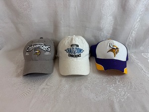 lot 222 image: Three New Baseball Hats - NFL 2008 Vikings NFC North Champions, WNBA 2012 Lynx Western Conference Champs, Vikings