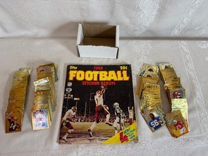 lot 249 image: 1983 Topps NFL Football Sticker Album (partially complete) with Box of Stickers