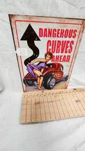 lot 210 image: 16x12 Dangerous Curves Metal Sign