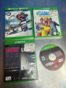 lot 15 image: Four Xbox One video game items, including used copies of Skate, The Sims 4 Deluxe Party Edition, Inside, and a disc for NBA 2K20.