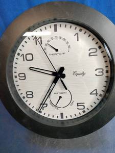 lot 56 image: Equity by La Crosse 10-inch Waylon indooroutdoor wall clock with thermometer and hygrometer.