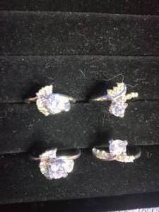 lot 33 image: 4 Stainless Steel Fashion Rings with CZ Stones - Size 7.5 to 7.75