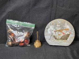 lot 33 image: Brass Bell, Holiday Decor Lot with Acorn Figures, and Illuminated Winter Scene