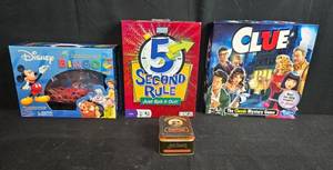 lot 56 image: Board Game and Card Game Lot Clue, 5 Second Rule, Disney DVD Bingo, Jack Daniels Playing Cards - contents unverified